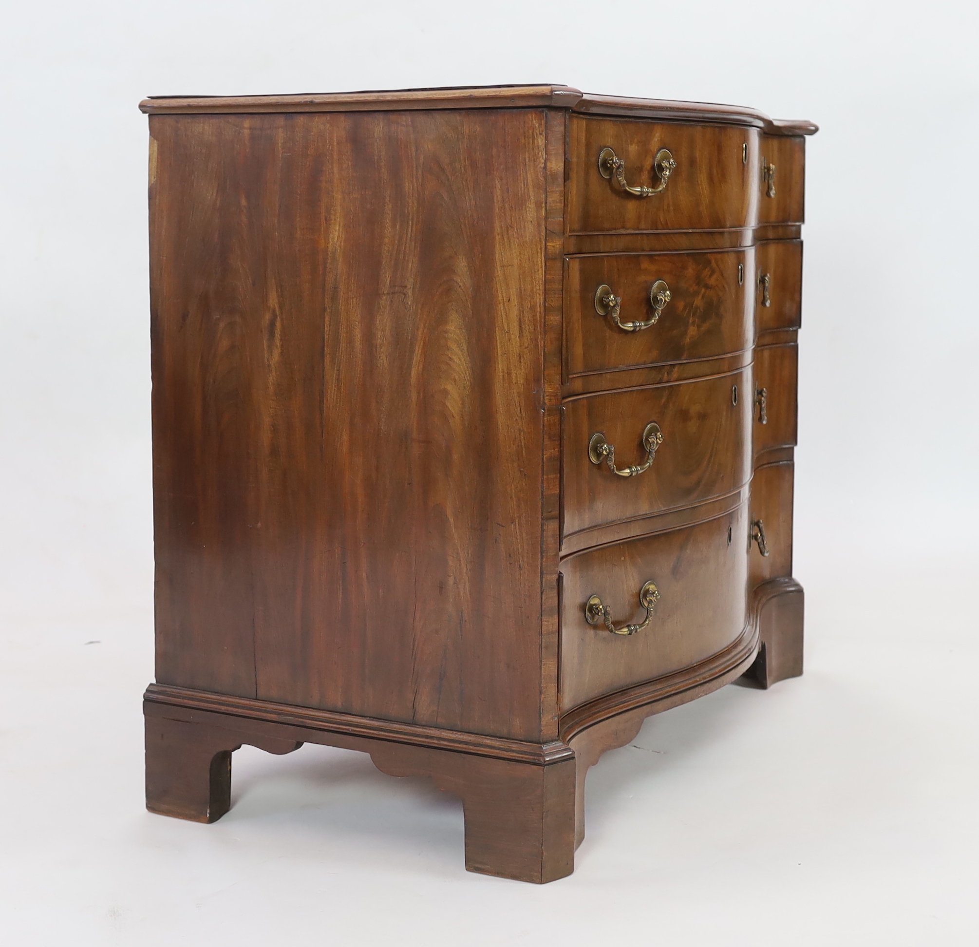 A George III mahogany serpentine dressing chest